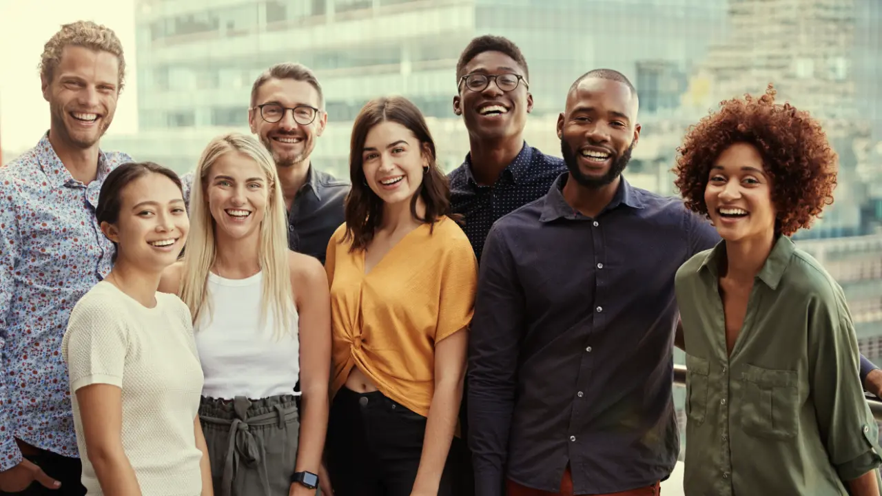 Photo of a group of young adults looking at camera